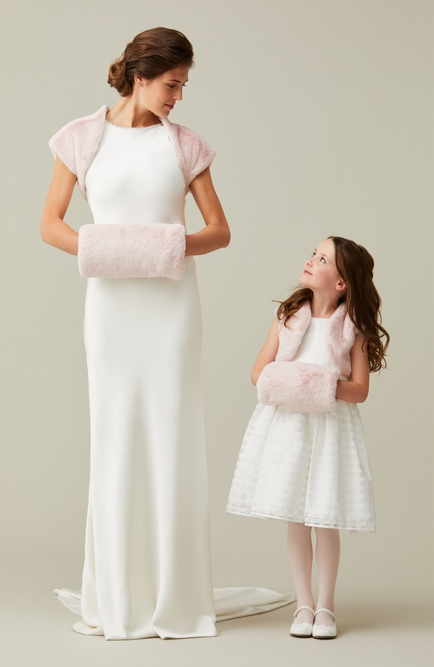 bride and flower girl with faux fur capes