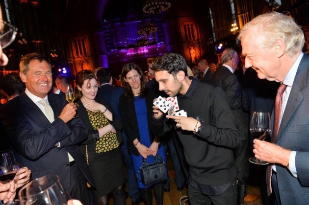 magician performing tricks at an event