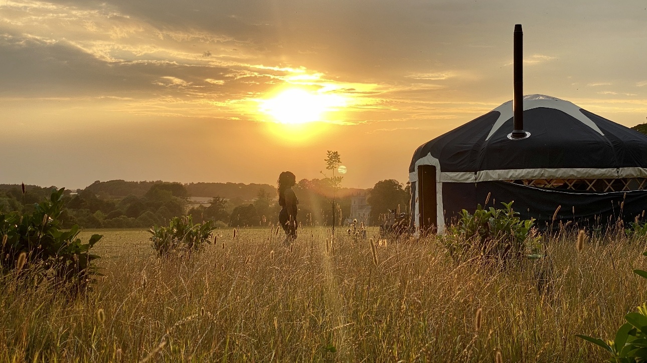 yurt at dusk in field