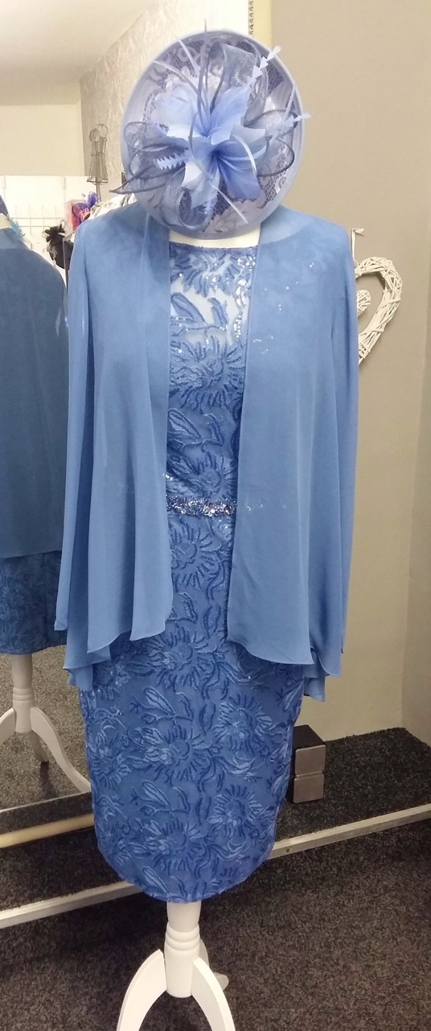 Blue mother of the bride outfit with matching fascinator.