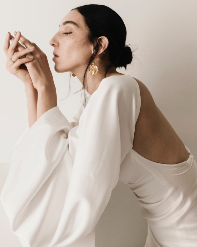 Model wears white Carmen Llaguno dress