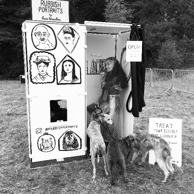 Woman with two dogs going into the rubbish portrait booth