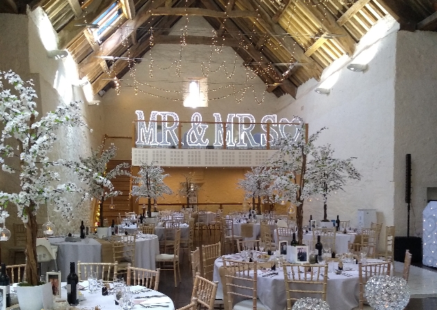 Interior of Dunster Tithe Barn set up for a wedding reception 