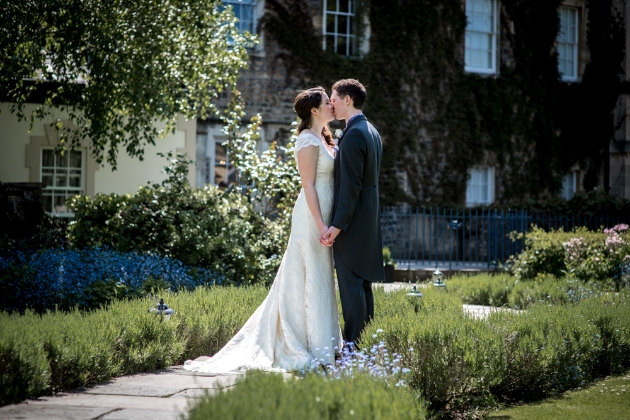 Bride and groom kissing in the gardens of The Royal Crescent Hotel 