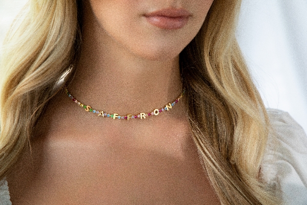 multicoloured diamante necklace with SAFFRON silver letters in it