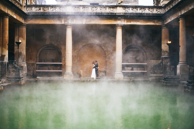 Couple embracing in front of the Roman Bath