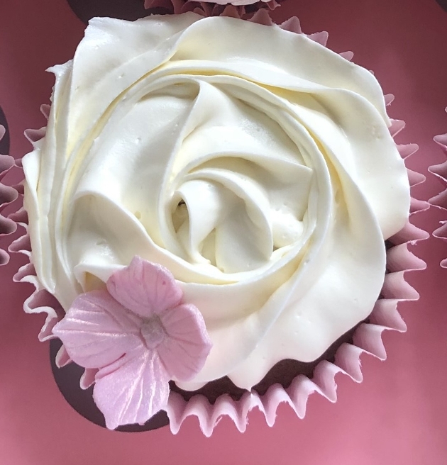 A cupcake that looks like a white rose