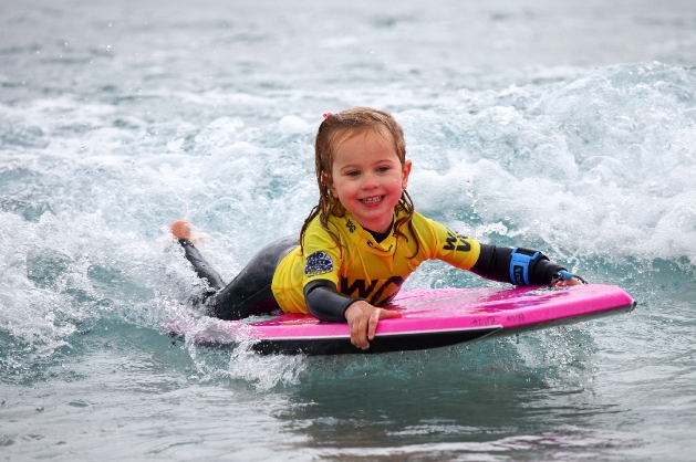Child body boarding at The Wave