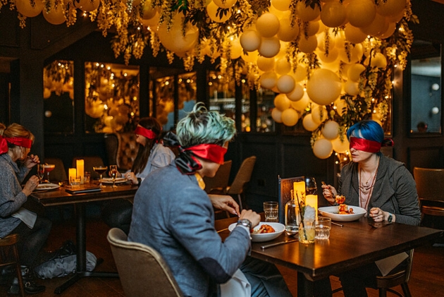 Blindfolded couple at Dining In The Dark night, Lost & Found Bristol