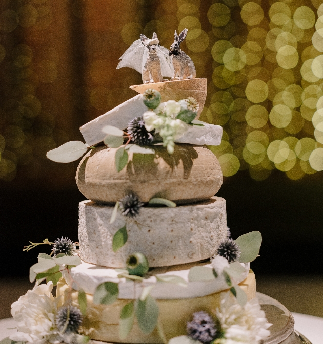 Wedding cheese tower topped with bride and groom hares