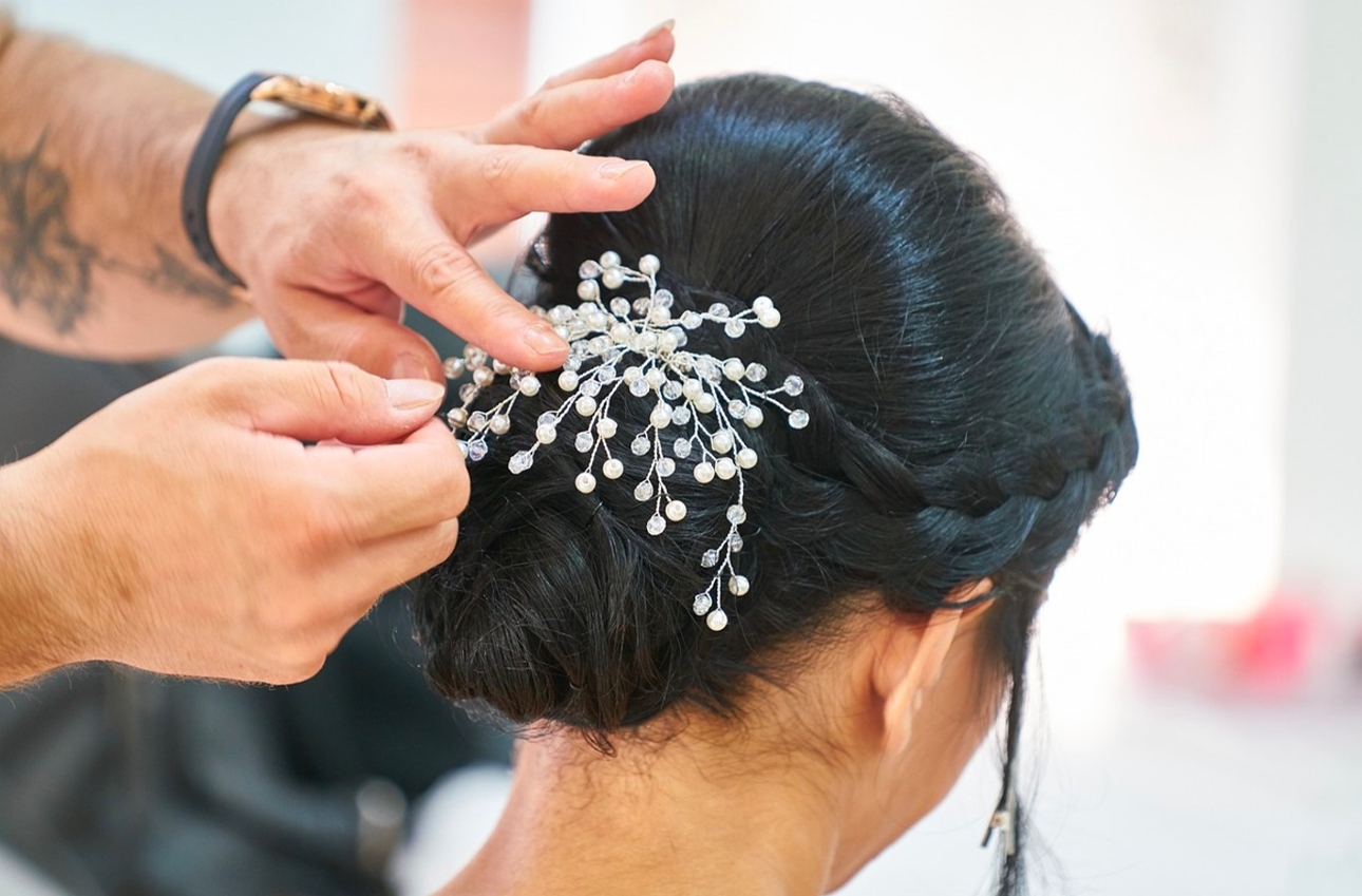 woman having her hair put up with sparkle clip