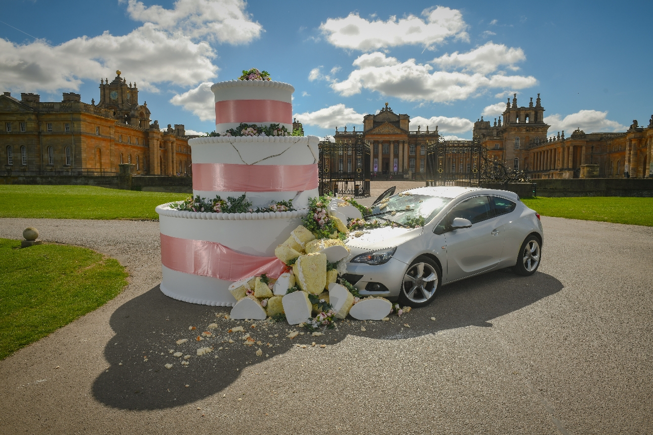 car crashing in to wedding cake outside historical venue